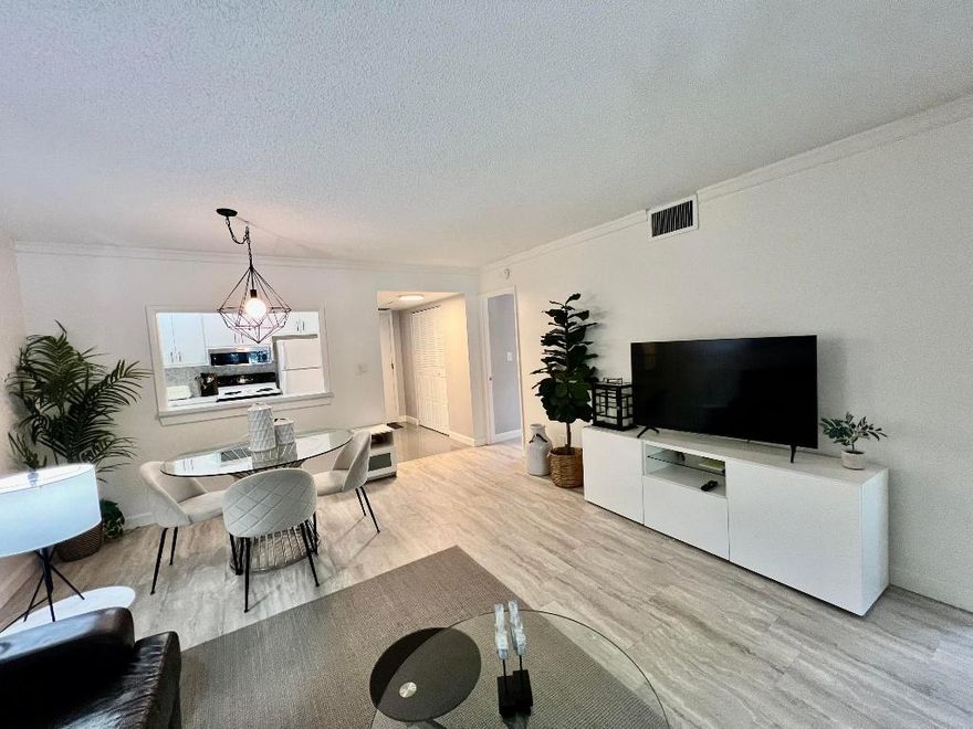 Modern and beautifully furnished 2BR/2BA corner unit in the desirable 55+ Meadows community. Located on the 2nd floor of Building 700—the newest phase with upgraded kitchen venting—this 870 sq.ft. condo offers garden views, turnkey comfort, and quality upgrades throughout. Renovated kitchen and master bath, newer A/C, dishwasher, electrical panel, fresh paint, and updated lighting. Walk-in closets, stylish blinds, and quality furnishings replaced in the last 3 years. Steps from laundry and parking. Enjoy a well-run community with great amenities and strong Canadian-American management. $40K in upgrades.