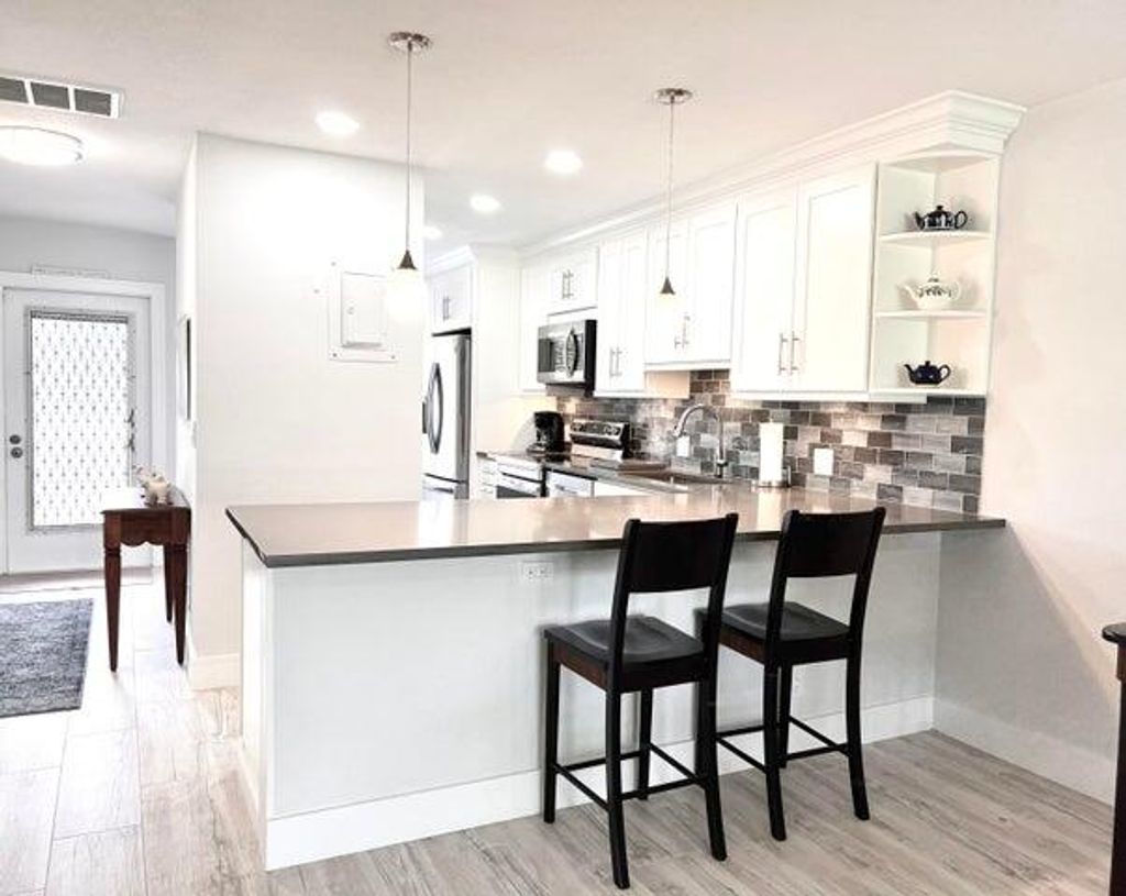 Photo of 1360 NW 19th Ter #202, Delray Beach, FL 33445 (MLS # R11051327)