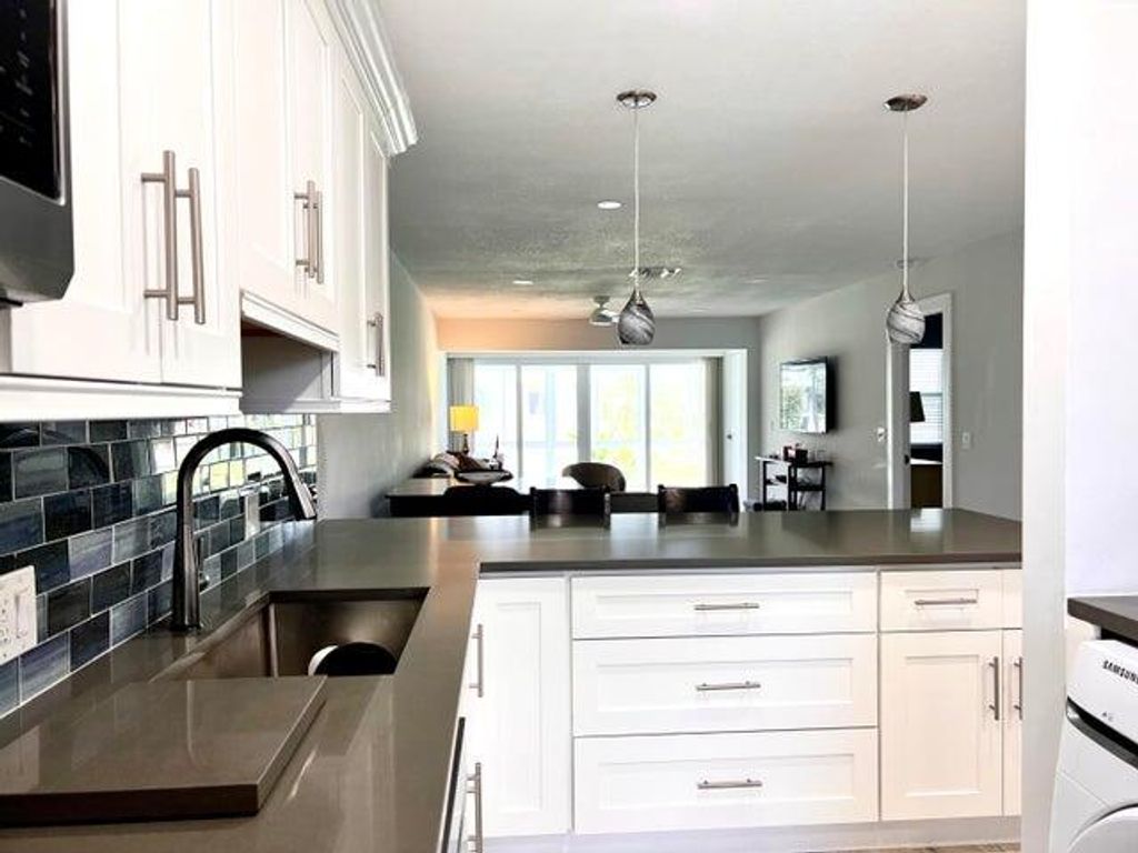 Photo of 1360 NW 19th Ter #202, Delray Beach, FL 33445 (MLS # R11051327)