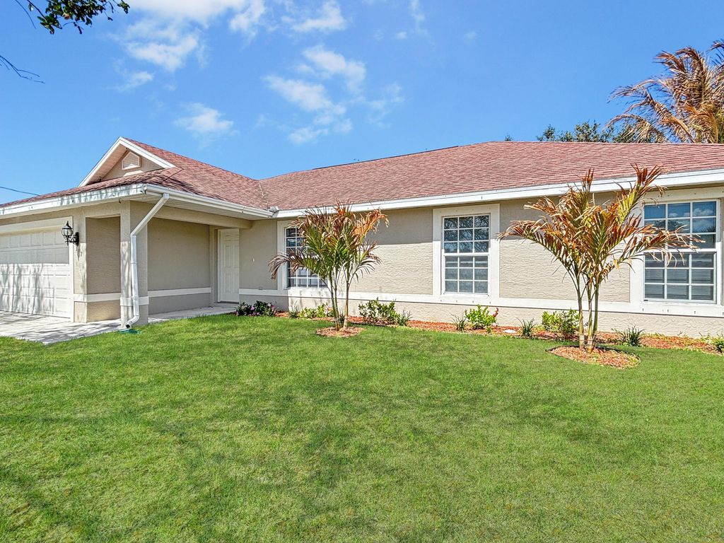 Photo of 117 SW Glenwood Drive, Port Saint Lucie, FL 34984 (MLS # R11161087)