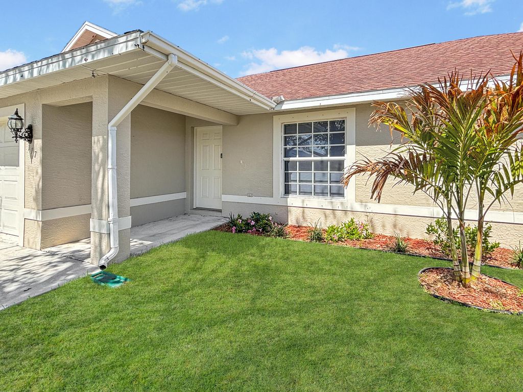 Photo of 117 SW Glenwood Drive, Port Saint Lucie, FL 34984 (MLS # R11161087)