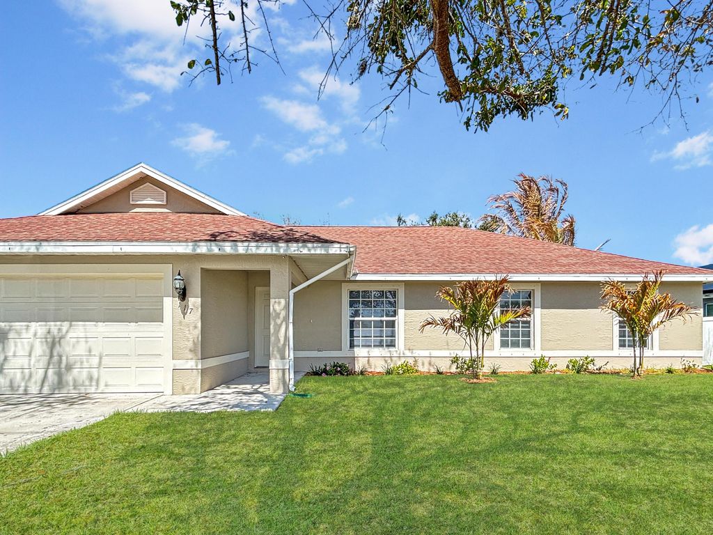 Photo of 117 SW Glenwood Drive, Port Saint Lucie, FL 34984 (MLS # R11161087)