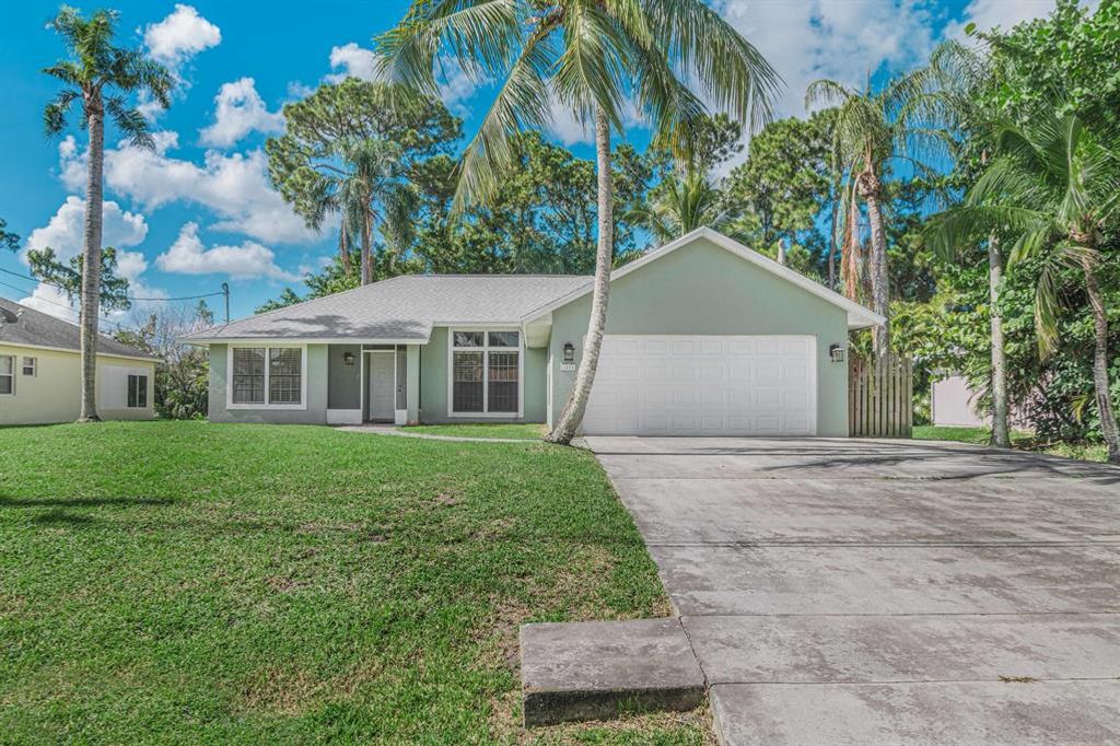 Photo of 1454 SW Medina Avenue, Port Saint Lucie, FL 34953 (MLS # R10732288)