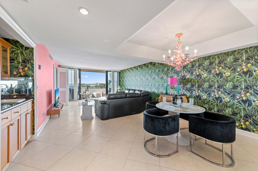 Prepare to be captivated by the sweeping, unobstructed views from this stunning 1-bedroom, 1.5-bathroom waterfront condominium. The bright and cozy living areas, including the dining space, are bathed in natural light, setting a cheerful coastal mood. The gourmet kitchen is both functional and stylish, featuring warm wood cabinetry, sleek granite countertops, and modern ceiling track lighting. For ultimate convenience, the unit includes a washer and dryer in-unit, eliminating the need for shared facilities. The spacious primary suite is a private sanctuary, boasting a desirable walk-in closet and an ensuite bathroom with a combo tub and shower. The entire home flows beautifully, leading directly to your covered balcony with protective shuttersthe perfect spot for enjoying evening cocktails overlooking the Intracoastal Waterway. Residents enjoy a luxurious lifestyle with a host of premier amenities, including two gyms, two pools, and coveted ocean access through the sister building on the Atlantic side of A1A. An assigned parking and a 24-hour doorman complete this package of security and convenience. This great home is located just minutes from fine shopping, dining and much more!