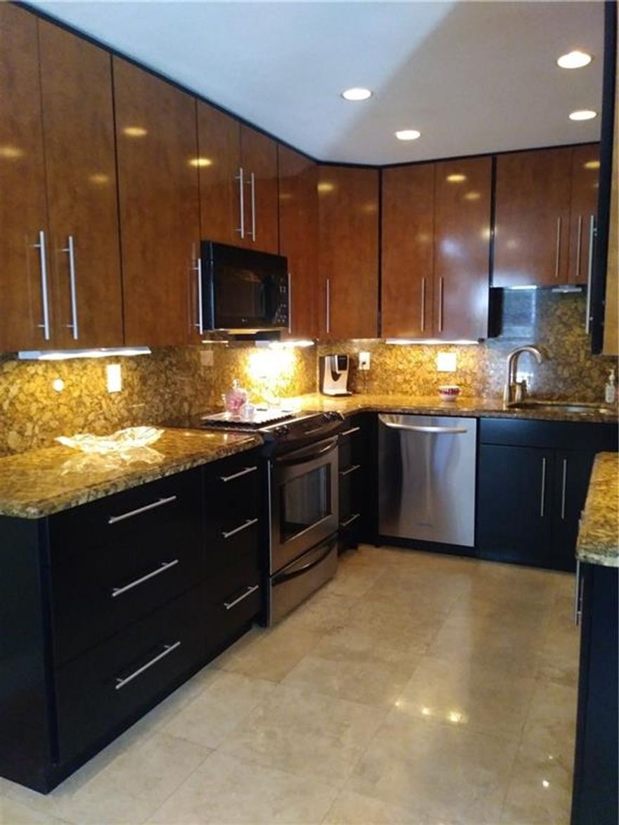 Unique corner townhouse in sought after area, private street, gorgeous kitchen with tall cabinets, stainless appliances, formal dining, laundry room, first floor l/2 bath, large livingroom with slider to beautiful covered patio , including grill area and some yard, set up for hot tub. Ulpper level has two masters, beautiful cherrywood floors, covered balcony. built in finished closets. Walking distance to stores, restaurants and shops. Pet friendly 20lbs+,  Aguest plus assigned parking.  Very tropical private setting. Also, homeowners association (you own the land) not a condo association.  Bring your fussiest buyer! Weekend showings only by appointment.