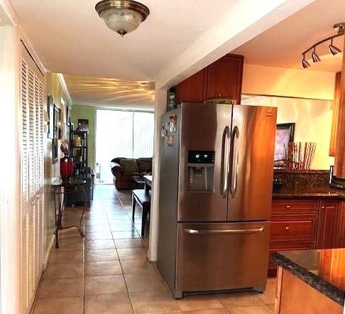 Beautiful water view updated 1 bedroom, 1 ½ bath condo situated on the corner of the first floor, very brite with extra windows and comes tastefully furnished ready for move-in. The kitchen has elegant granite counters and stainless steel appliances. The kitchen leads to a spacious dining/living room area with a bonus Florida room. Tile flooring throughout the unit, all appliances, water heater and Ac Units have a transferable warranty In Phase III, you'll have access to great amenities such as a golf course, tennis courts, pickleball courts, shuffleboard, cable, water, gym, billiards, bingo, theater, jacuzzi, heated covered pool, sauna, ping pong, comedy shows, and more. It's like living in a resort every day!