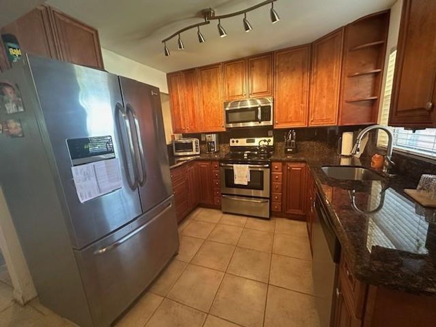 Beautiful water view updated 1 bedroom, 1 ½ bath condo situated on the corner of the first floor, very brite with extra windows and comes tastefully furnished ready for move-in. The kitchen has elegant granite counters and stainless steel appliances. The kitchen leads to a spacious dining/living room area with a bonus Florida room. Tile flooring throughout the unit, all appliances, water heater and Ac Units have a transferable warranty In Phase III, you'll have access to great amenities such as a golf course, tennis courts, pickleball courts, shuffleboard, cable, water, gym, billiards, bingo, theater, jacuzzi, heated covered pool, sauna, ping pong, comedy shows, and more. It's like living in a resort every day!