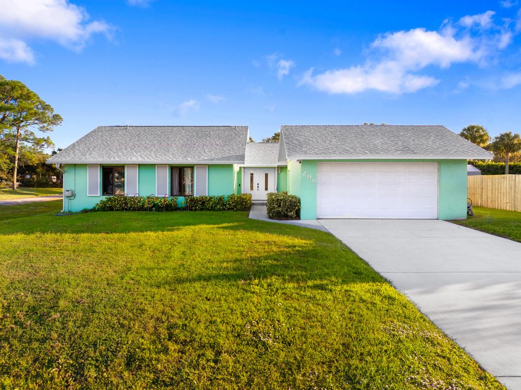 Photo of 298 SE Grove Avenue, Port Saint Lucie, FL 34983 (MLS # R11042203)