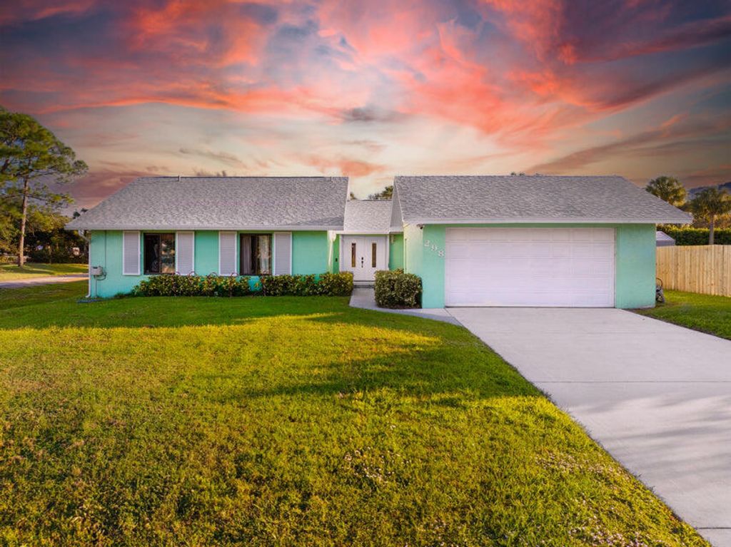 Photo of 298 SE Grove Avenue, Port Saint Lucie, FL 34983 (MLS # R11042203)