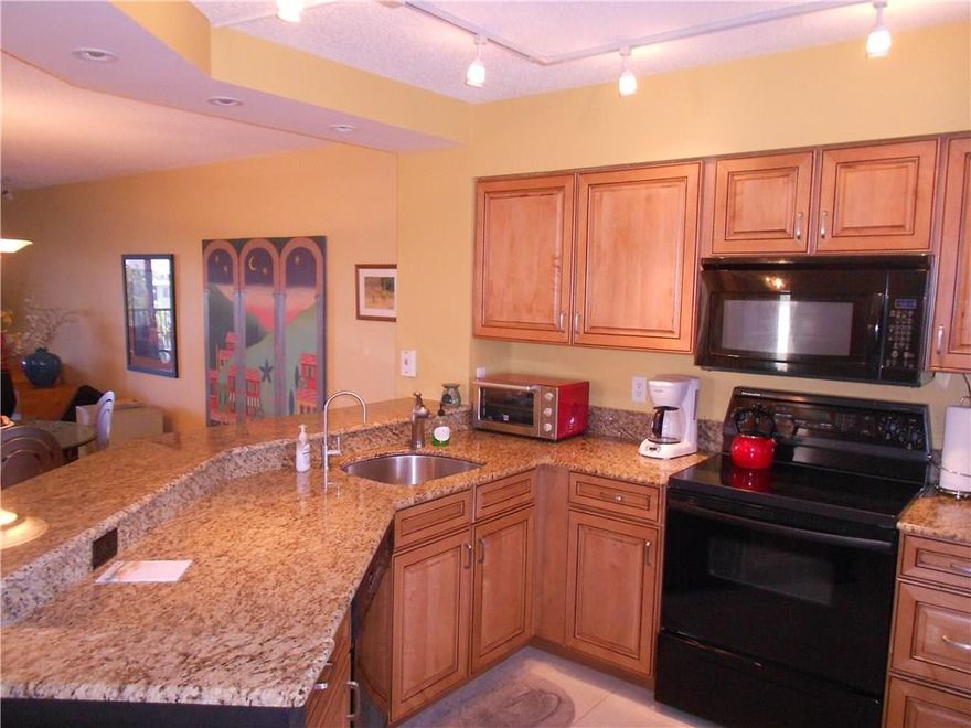 New Windows '06, New A/C 2017 CORNER- Best on the Island, FALL IN LOVE HERE- Designer Decorated Furnished with Beautiful Colors, Relax & Enjoy Morning Coffee & Evening Beverages on Your Private Screened Balcony w/Incredible Lake Views. Lots of Natural Light CORNER Condo, Granite Kitchen & Newer Cabinets, Recessed/High Hat lighting, LARGE Master w/huge walk-in closet. RESORT Lifestyle, Clubhouse, Pool, Gym, Sauna, Tennis, Racquetball, Jog/Nature Trail. Near Isle Casino & Beach