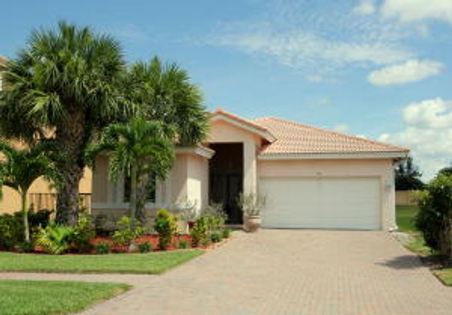 Upgrades Galore!!! This home features laminate wood floors throughout the entire home and tile floors in the bathrooms. Newly remodeled kitchen that boasts granite countertops,decorative backsplash, stainless steel appliances, new A/C 2013 and so much more to mention.  All of this plus a .32 acre lot!!!!**BONUS-child's outdoor playset stays**