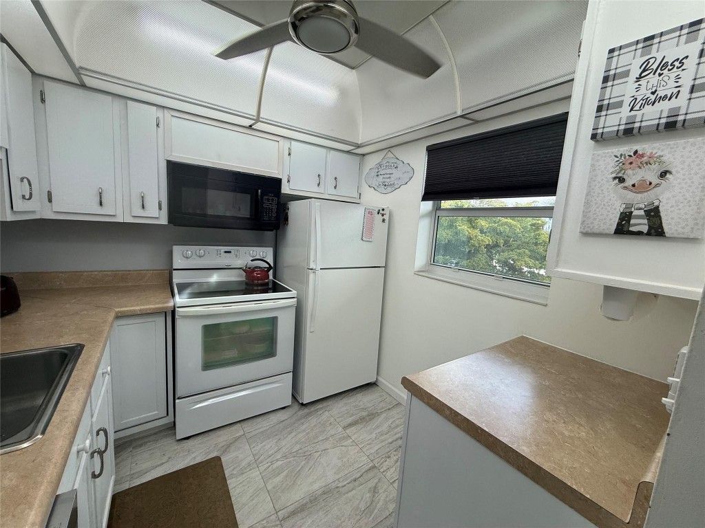 Photo of 3431 NW 50th Avenue #304, Lauderdale Lakes, FL 33319 (MLS # F10545064)