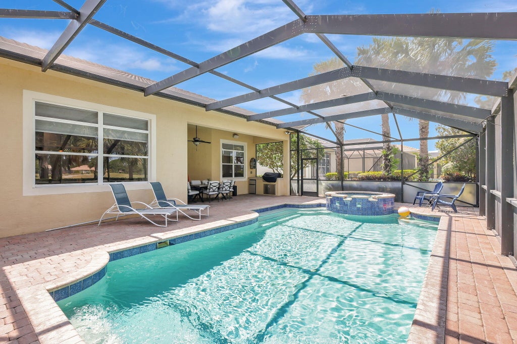 Photo of 9800 SW Nuova Way, Port Saint Lucie, FL 34986 (MLS # R11049285)