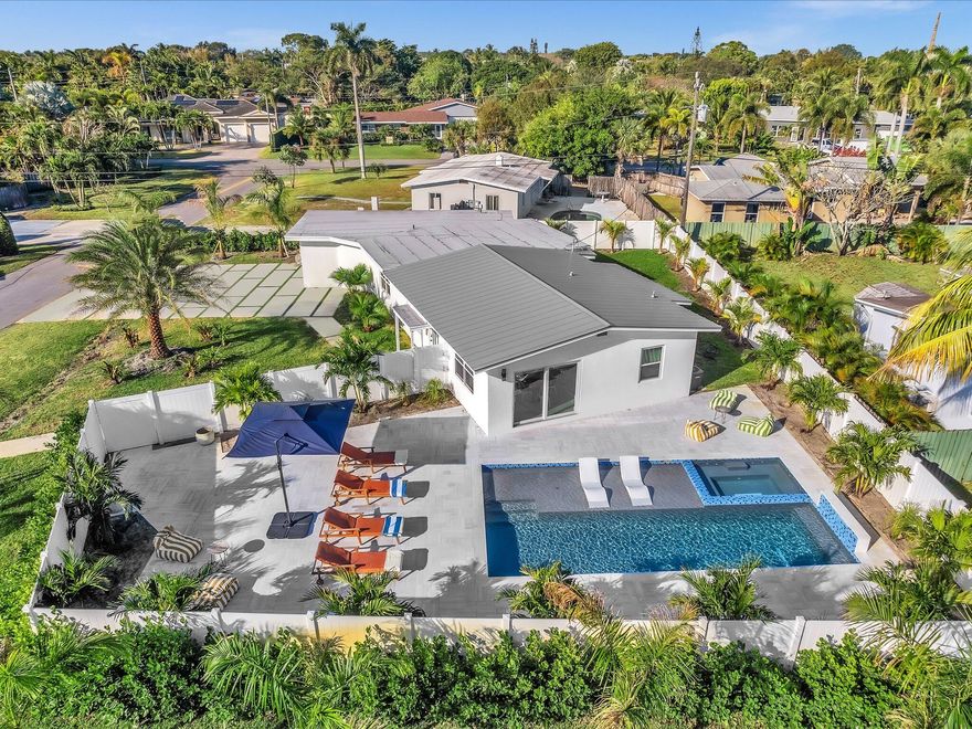 Welcome to this exceptional newly renovated modern luxury 4-bedroom, 3-bathroom residence located in the heart of Wilton Manors. This home offers a perfect blend of style, comfort, and prime location. Situated on a spacious corner lot of 10,650 sq ft, featuring a spacious private backyard with open sky, a heated saltwater pool and spa with a stunning waterfall feature. The large open-air outdoor space and oversized yard provide the perfect setting for entertaining, relaxing, and enjoying the South Florida lifestyle. Prime location close to restaurants and nightlife, just a few blocks from the Drive.