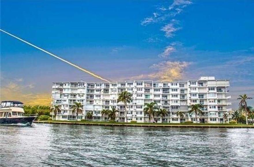 New England charm meets South Florida waterfront living in this renovated 6th-floor 1BR/1BA condo with sweeping Intracoastal and ocean views. Thoughtfully updated kitchen with granite countertops, upgraded cabinetry, stainless appliances, and modern lighting. Rich wood flooring, crown molding, impact windows, custom walk-in closet, and a spa-style bath with granite, wainscoting, and new tub/tile create a timeless, coastal-classic feel. The private balcony is perfect for morning coffee, sunsets, and holiday boat parades. Major building upgrades noted by seller: concrete restoration completed, new seawall, roof (2024), fresh paint, and upcoming impact exterior door/windows. Minutes to ocean, dining, and shops—ideal year-round or seasonal retreat. Calling listing agent for a tour.