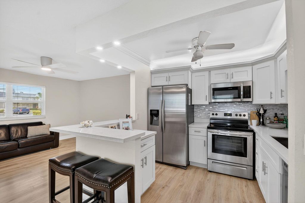 Photo of 582 Monaco Way #M, Delray Beach, FL 33446 (MLS # B26010775)