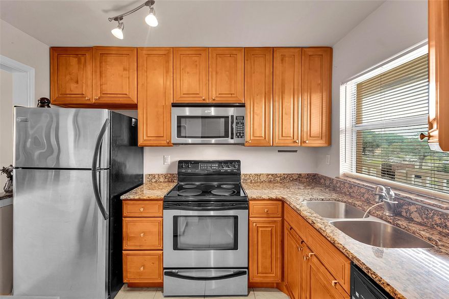 Welcome to this bright and spacious third-floor condo in a highly desirable 55+ active adult community. This home features an updated kitchen with modern cabinetry and stainless steel appliances, along with tile flooring throughout no carpet! Enjoy the serene golf and lake views right from your living room or private balcony.Spacious split-bedroom layout. Move-in ready. The community offers resort-style amenities including a clubhouse with shows, concerts, dances, a fitness center, billiards, three pools, a jacuzzi, sauna, tennis courts, racquetball, shuffleboard, a movie theater, and both gas and charcoal BBQ areas for outdoor entertaining. Five minutes from Sawgrass Mills Mall and 20–25 minutes from beaches and airport. This is Florida living at its best schedule your showing today.