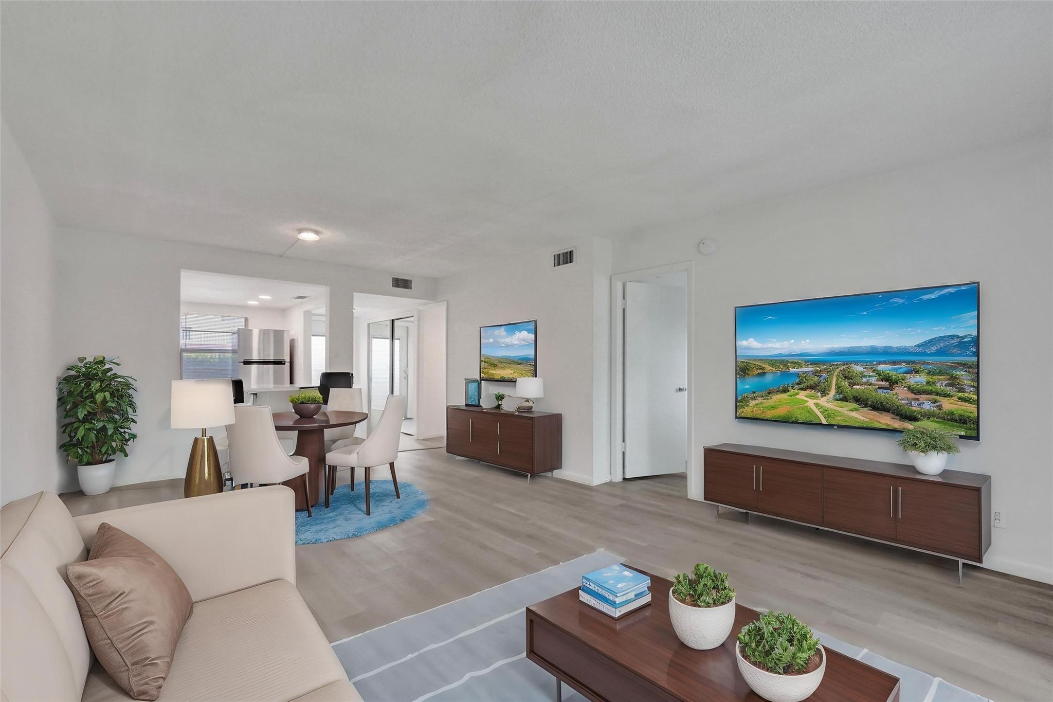 Welcome to this beautifully renovated condominium in Oriole Gardens Section 1. This delightful 2-bedroom, 2-bathroom unit features a peaceful canal view from the enclosed patio, providing a perfect blend of privacy and tranquility. Located on the first floor, the unit comes with a deeded parking spot conveniently situated right in front. Inside, you'll find a modernized kitchen with white cabinetry and new stainless-steel appliances, complemented by vinyl flooring throughout and updated bathrooms. Oriole Gardens offers fabulous amenities, including a pool, an exercise room, an auditorium, billiards, and a card room. The location is ideal, with easy access to major highways, dining, shopping, and just a short drive to the beach. Don’t miss the chance to make an offer on this lovely home!