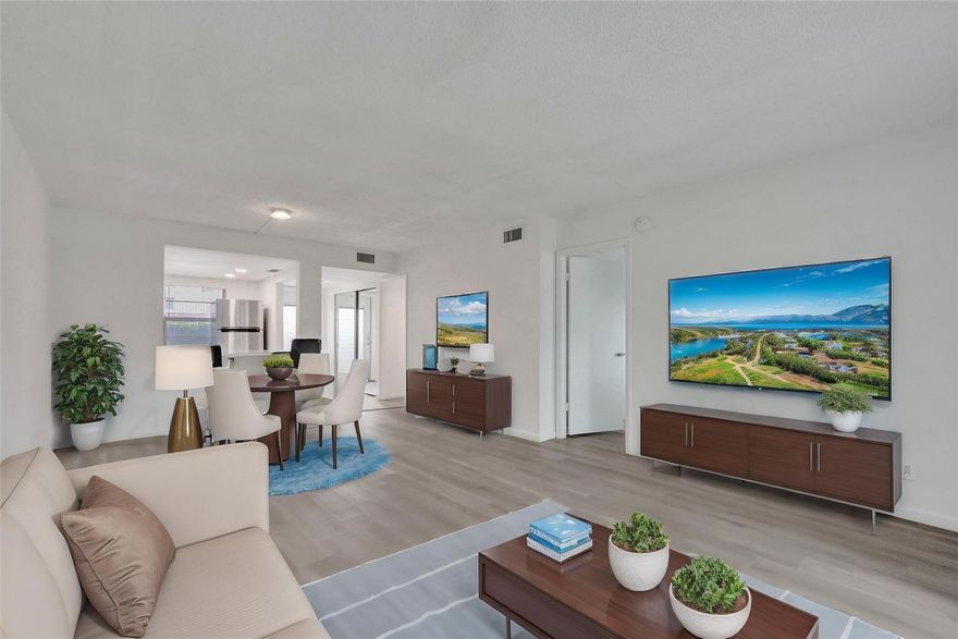 Welcome to this beautifully renovated condominium in Oriole Gardens Section 1. This delightful 2-bedroom, 2-bathroom unit features a peaceful canal view from the enclosed patio, providing a perfect blend of privacy and tranquility. Located on the first floor, the unit comes with a deeded parking spot conveniently situated right in front. Inside, you'll find a modernized kitchen with white cabinetry and new stainless-steel appliances, complemented by vinyl flooring throughout and updated bathrooms. Oriole Gardens offers fabulous amenities, including a pool, an exercise room, an auditorium, billiards, and a card room. The location is ideal, with easy access to major highways, dining, shopping, and just a short drive to the beach. Don’t miss the chance to make an offer on this lovely home!