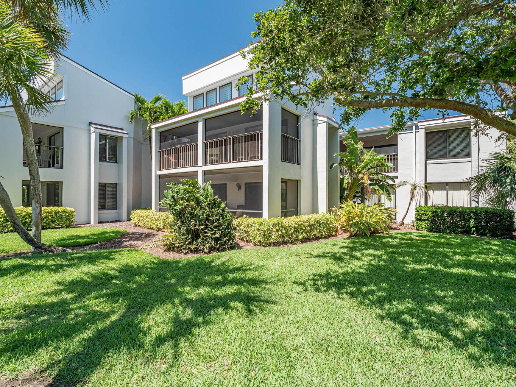 This amazing 2nd floor ranch style home has 2 large bedrooms each with a newer full bath. Completely renovated with newer laminate flooring throughout. Cathedral ceiling in living room, plantation shutters, granite kitchen counters with newer appliances, cozy fireplace for the rare chilly evening in paradise. Full dining room, large porch overlooking green lawn area and delightful cross breeze. Short walk to the beach, all within the Moorings. Tropical decorating - light and airy. A real turnkey. Full sized washer and dryer.