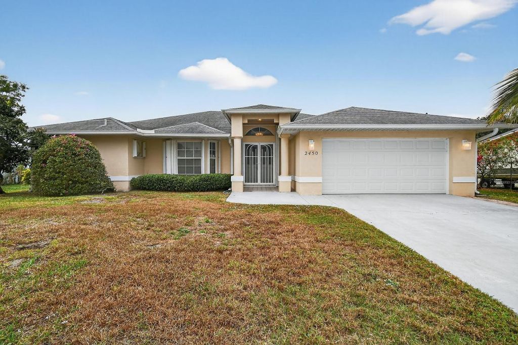 Photo of 2450 SE Perugia Street, Port Saint Lucie, FL 34952 (MLS # R11154709)