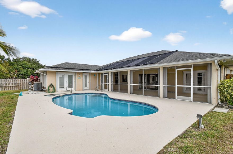 Beautiful 3 bedroom, 2 bath CBS POOL home with 2 car garage featuring a private backyard facing a serene nature area. A huge enclosed  patio with  sliding doors that open completely  perfect for entertaining. Great split floor plan with both the primary and second bedrooms having direct access to the patio.Spacious kitchen, breakfast area,  New A/C 2025, solar panels, and solar-heated pool. NO HOA.Conveniently located near shops, restaurants, and the interstate. A must-see home combining comfort, style, and privacy.