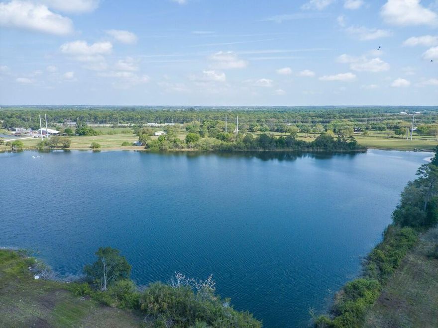 18.39 Acres with Spring-Fed Lake plus OWNER FINANCING - Stunning 18.39 Acres with Spring-Fed Lake - Your Dream Oasis Awaits! Discover an exceptional opportunity to own 18.39 acres of pristine land featuring a breathtaking spring-fed lake, reaching depths of 100 feet. This unique property is perfect for diving enthusiasts, offering an ideal setting for diving practices or leisurely afternoons spent fishing from your custom dock. With 4 acres of prime, buildable land, you can design and construct your dream home surrounded by natural beauty. Enjoy the peace and privacy of this high and dry property, free from any chemical residues from past citrus farming. Utilities are conveniently nearby, ensuring a seamless transition to your new lifestyle.