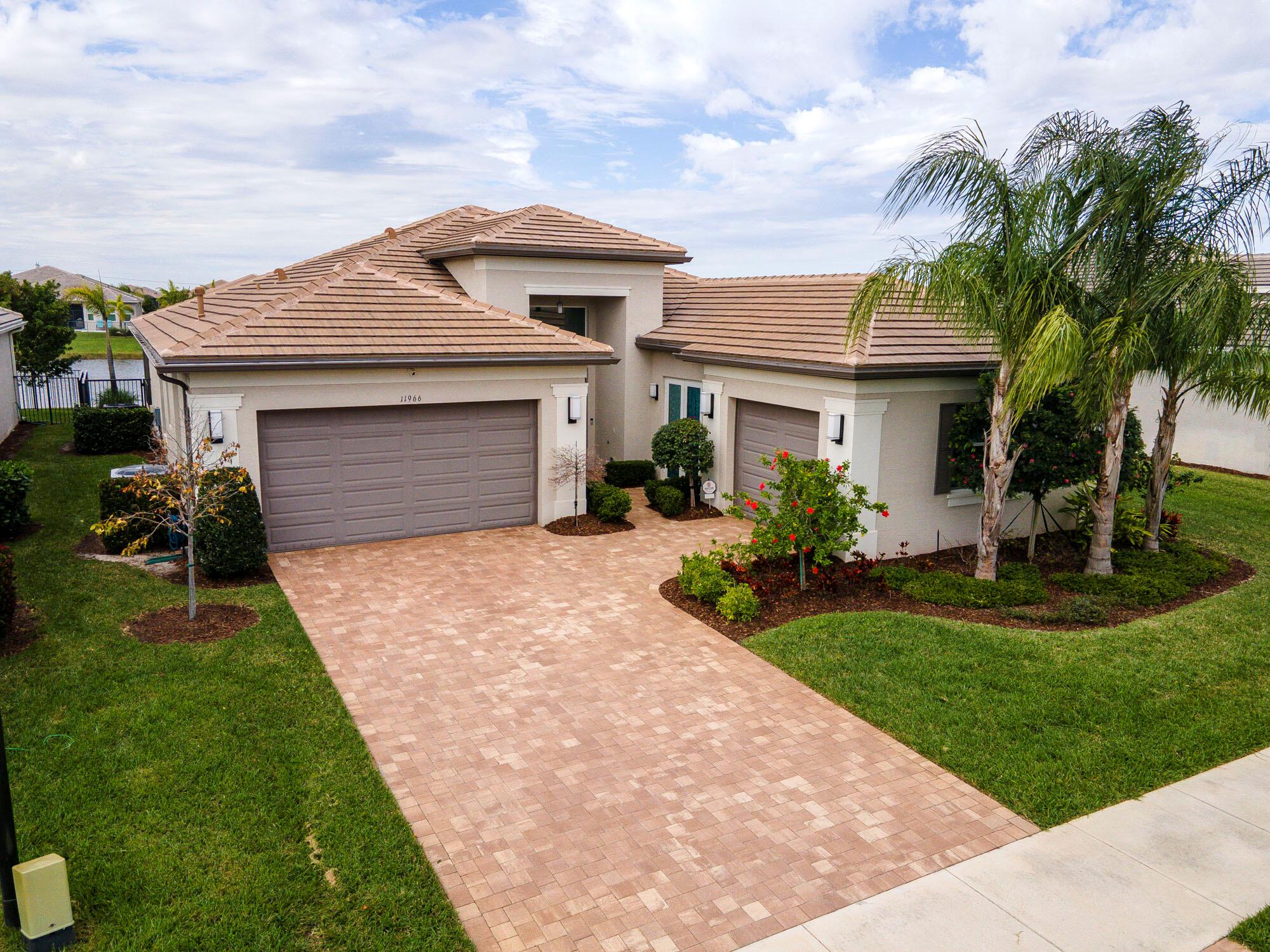 Come enjoy this beautiful Caroline Model, POOL HOME in the prestigious 55+ community of Valencia Grove. This home features 3-bedrooms, 2.5-bathrooms, 3 car garage and over 2,500 square feet of living space. The elegant granite countertops, vaulted ceilings and ceramic tile throughout are just a few of the upgrades this well-maintained home comes with. The backyard is a private oasis with an amazing SCREENED-IN, SALT-WATER POOL on an oversized lot with tons of patio space, and gorgeous LAKE VIEWS to watch the Florida Sunsets. Riverland sets the bar when it comes to amenities and no other community compares It boasts a 34,000 sq ft clubhouse, multiple resort style pools, massive fitness center, arts and culture center, tons of PICKLE BALL courts, in-door basketball courts, outdoor parks,