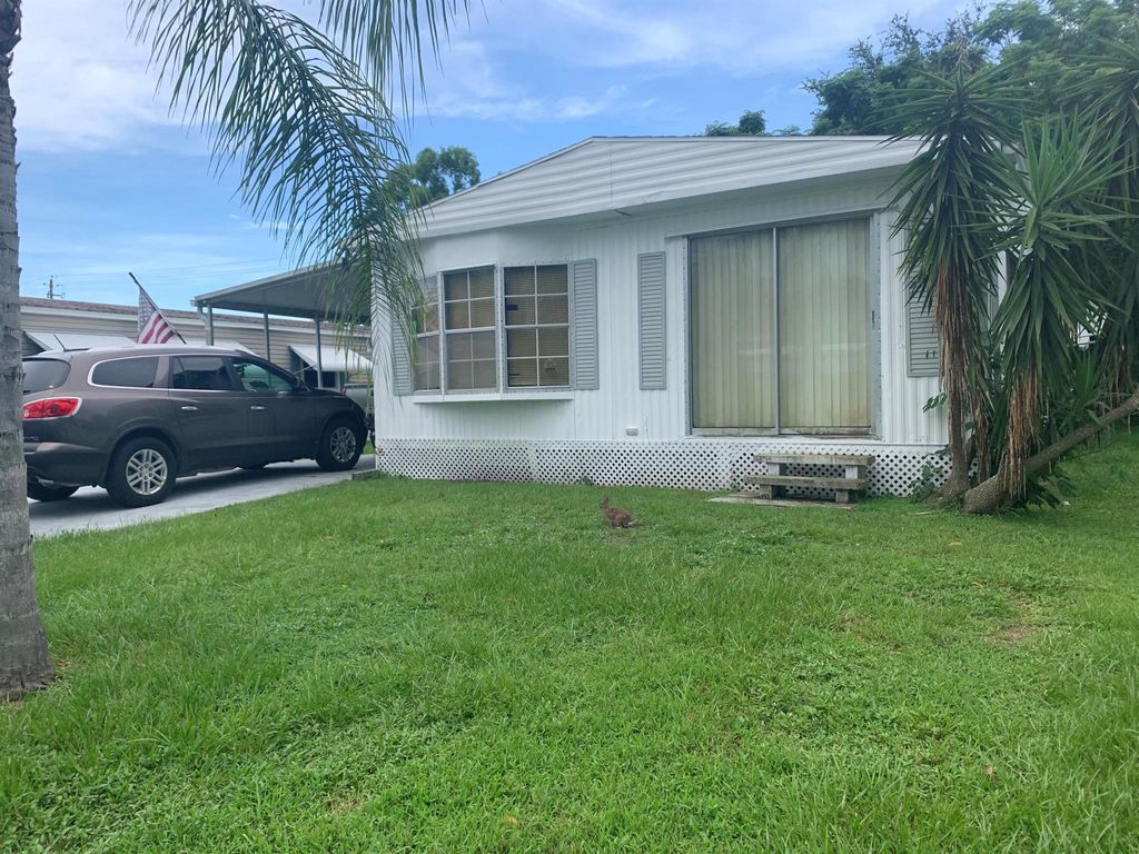 Photo of 117 E Caribbean, Port Saint Lucie, FL 34952 (MLS # R10905884)