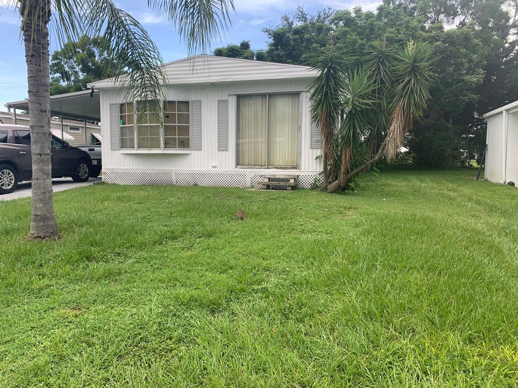 Photo of 117 E Caribbean, Port Saint Lucie, FL 34952 (MLS # R10905884)