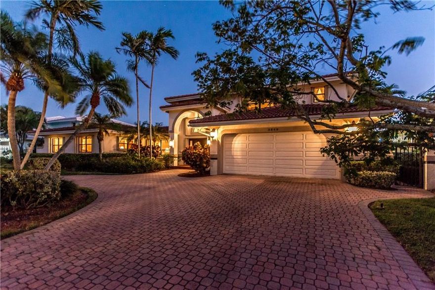 Don't miss this opportunity to live on a premium street in Lighthouse Point, Southern exposure, wide canal, 100' dock, 7 mins to inlet, Mahogany double doors are your entry way to this spacious open floor plan home.  Open kitchen with island, floor to ceiling coral fireplace, wet-bar in living room, central vac, balcony with beautiful views of the extra wide canal.