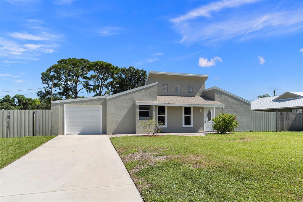 Located in the heart of Port Saint Lucie, this is the PERFECT starter home for a new family or even the perfect place to settle and retire in. All of your big priced items are taken care of with a NEWER ROOF (2018) & a NEWER A/C. Split bedrooms make for great privacy, and the back den can easily be converted into a 3rd bedroom! Complimented with a beautiful fenced in backyard, and plenty of space for a pool. Move in ready and waiting for you, schedule a showing today!