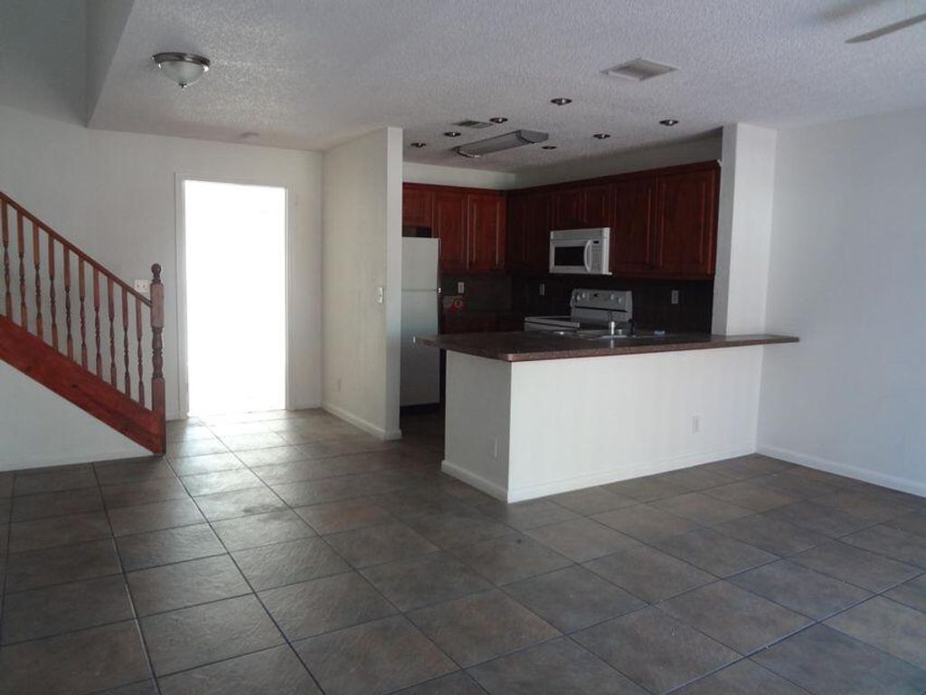 Photo of 930 Cypress Way E, Palm Springs, FL 33406 (MLS # R10953033)
