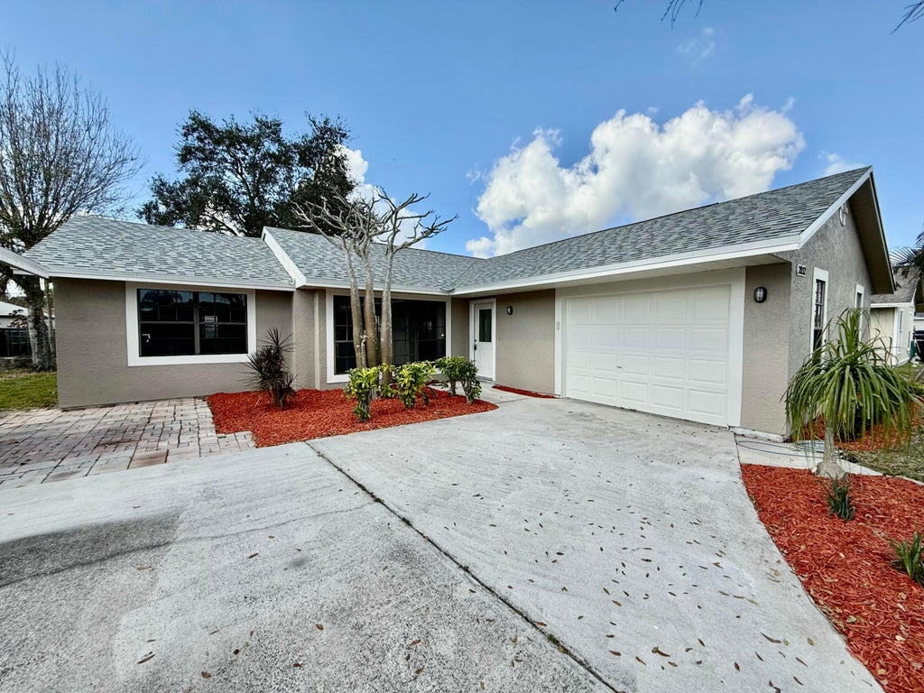 Photo of 2032 SW Greenan Lane, Port Saint Lucie, FL 34953 (MLS # R11060948)
