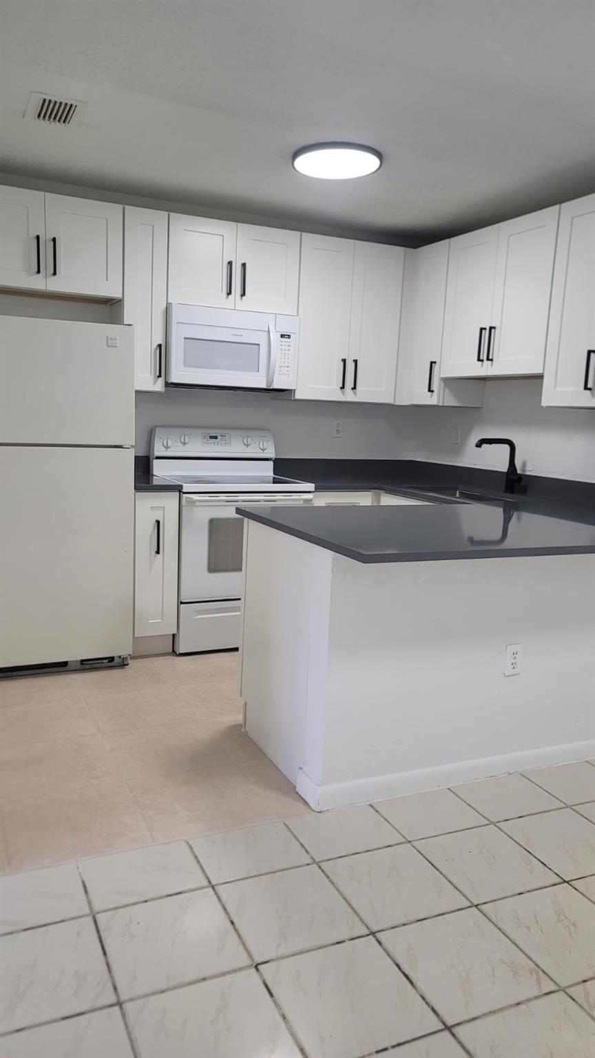 This beautiful 2-bedroom,2 bathroom condo offers a perfect blend of modern living and convenience. Located just minutes from Miami Lakes, and major roadways. Updated kitchen, washer and dryer inside the unit, freshly painted. Pool and children's playground located close to the unit! Don't miss out on this exceptional opportunity! Easy to show, lockbox located at the front door. Tenant pays utilities. Unit comes with 2 assigned parking spaces.