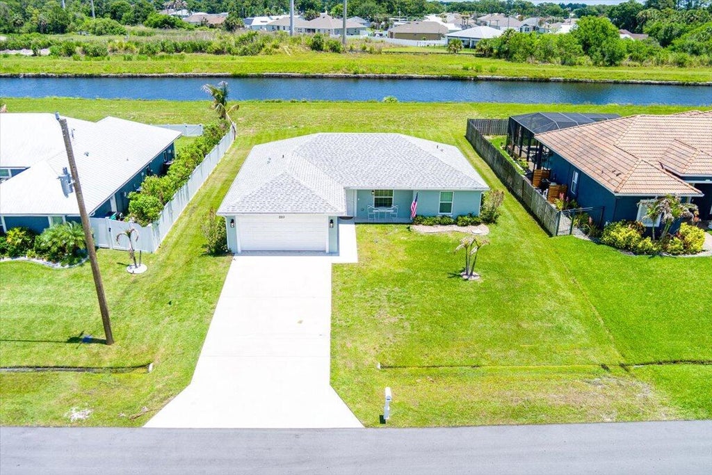 Photo of 2213 SW Salmon Road, Port Saint Lucie, FL 34953 (MLS # B26031717)