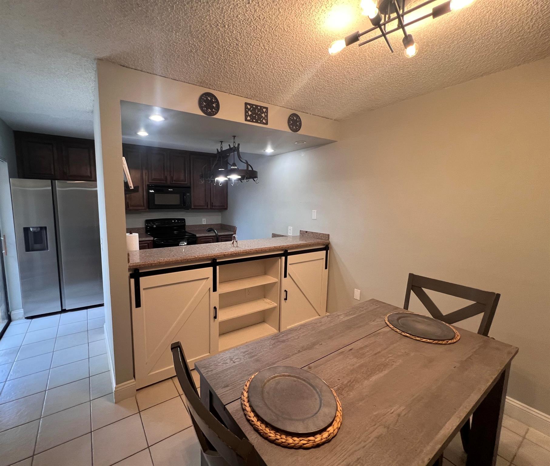 COME AND SEE THIS LOVELY TOWNHOUSE- COMPLETELY UPDATED. Refrigerator, Washer and Dryer are less than one year old, air conditioner less than 5 years old, roof replaced 2024 and fence is due to be replaced next budget year. Has only had two owners and has never been rented. Custom vanity in bathrooms as well custom built-in in dining room.The house has a crisp, clean modern farmhouse aesthetic.