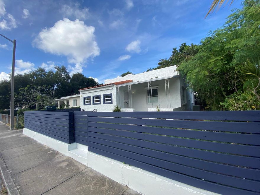 Excellent for Owner/Occupant or for income potential.  Excellent opportunity for VACATION RENTAL TURN KEY OPERATION FULLY FURNISHED consisiting of a total of 6 bedrooms / 4 baths (4 Bedrooms and 2 bathrooms in main house, plus a rear guest house with 2 bedroom 2 baths that Owner can live in /or rent separately for extra income). Great location being just a couple blocks to the Miami Design District, Wynwood, Shopping Mall, all types of restaurants, plus main access roads including I-95. This property is in good condition. It has porcelain tile floors throughout plus many upgrades including a brand new roof in 2023. Impact windows and doors, great deal for the money in this quiet residential area. Pleasure to show.....MOTIVATED SELLER Bring Offers$$$