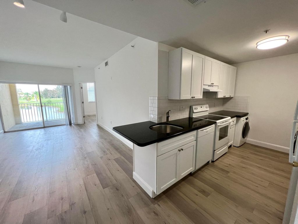 Photo of 2040 Greenview Shores Boulevard #214, Wellington, FL 33414 (MLS # B26006482)