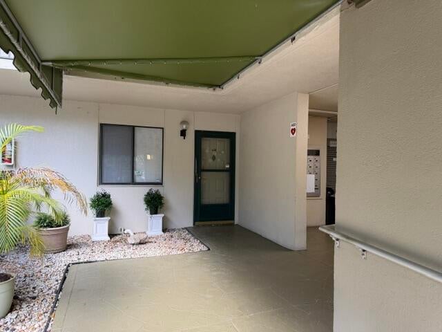 Photo of 2209 S CYPRESS BEND Drive #104, Pompano Beach, FL 33069 (MLS # B26067435)