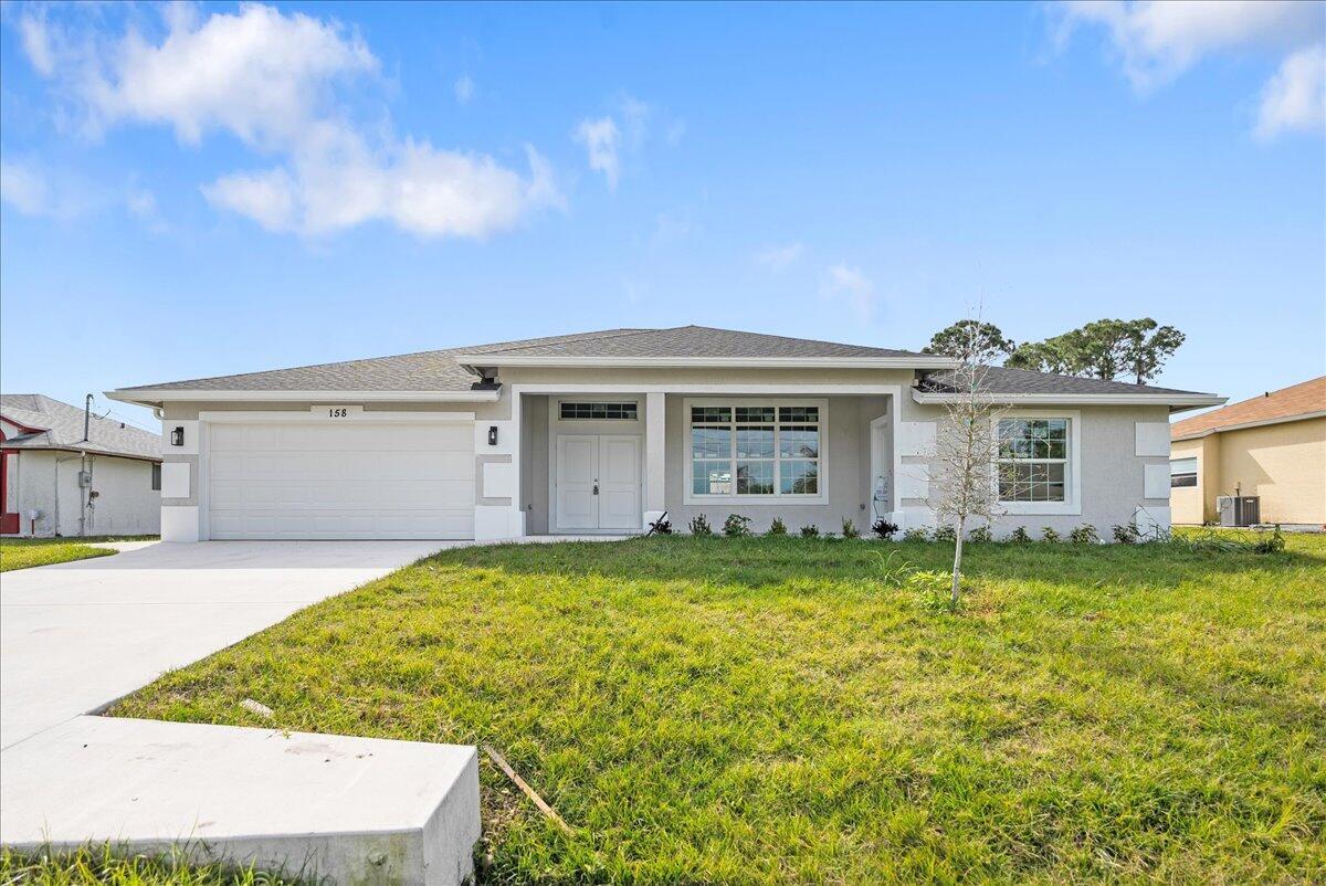 New construction house in desirable area of Port St Lucie. House boasts 4 bedrooms and 3.5 bathrooms. It has an outdoor shower and tons of room for a pool. .House has tons of upgrades. Ten foot ceilings in common area, open, modern floor plan, impact windows, waterfall style kitchen island, granite backsplash, upgraded granite in kitchen, bathrooms and window sills, porcelain tile throughout the house, bathroom tiled floor to ceiling. Soft close kitchen cabinets, seamless glass shower enclosures, modern lighting fixtures and LG kitchen appliance package. over $60,000 in upgrades already included in the house.