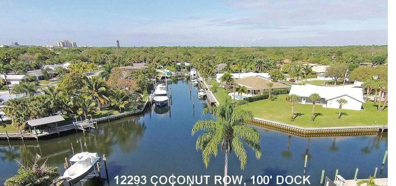 FANTASTIC 3 BEDROOM/ 2 BATH POOL HOME WITH PRIVATE DOCK. The Perfect Location, tucked away in a quiet, quaint neighborhood, with close proximity to shopping, restaurants, Harbor Financial Center, and Frenchman's Forest Natural Area for hiking! 100' Dock is AMAZING, AND features TWO (2) 24K Hydraulic BOAT LIFTS w/ water, and electric. NO FIXED BRIDGES! Outdoor space offers privacy, resort style pool with spa, gas hook up for BBQ area, and expansive Lounge Deck! The Primary Bedroom En suite feature new renovated bath with frameless glass shower. Open floor plan works for all your entertaining needs! .Gorgeous Mature Landscaping features Mango and Banana Trees and offers Privacy Galore! Close proximity to Benjamin School! Check out the B-E-S-T priced POOL HOME with DOCK in Palm Beach Gardens