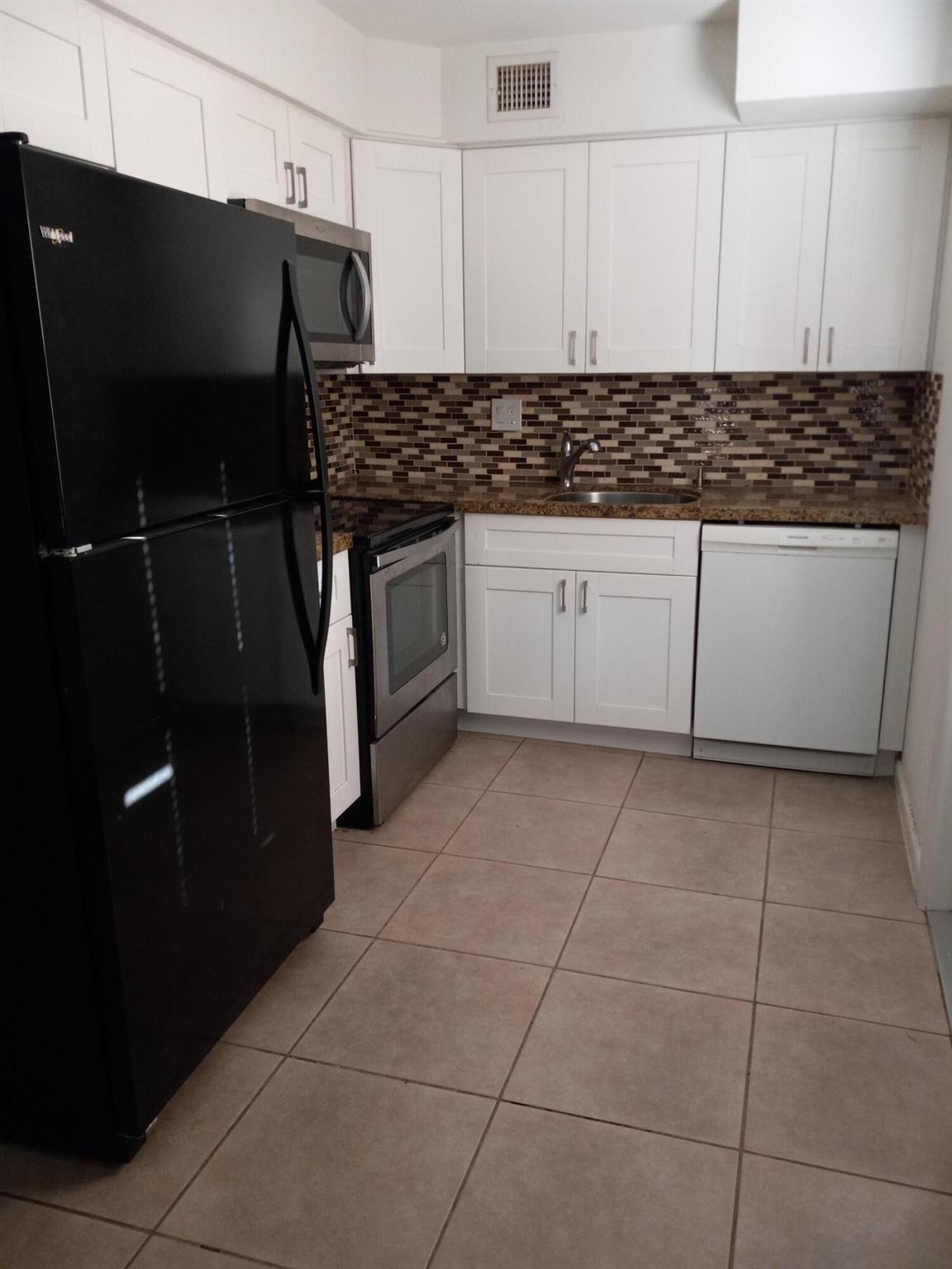 All tile duplex with water included in rent, 1 bedroom 1 bath, central a/c, updated kitchen, granite countertops, dishwasher, microwave, shared laundry room.