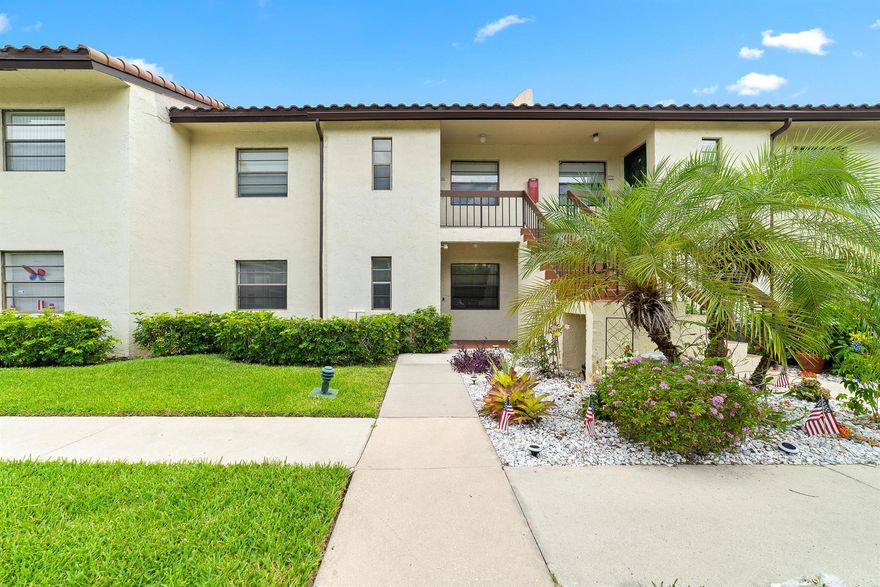 No stone was left unturned in this beautifully remodeled, 2 bedroom, 2 bathrooms, ground floor unit in the phenomenal, active 55+ Boca Lago community. The unit was completely updated in 2022. It is not just about a great location that is minutes from Boca's best golf courses, shops and restaurants. There is gorgeous gray plank vinyl flooring throughout. Recessed LED lights and crown moldings create a clean and elegant ambiance. The open concept kitchen is equipped with stainless steel appliances, gorgeous quartz countertops, white quiet shaker cabinets and soft-close drawers. The primary bedroom offers a generous walk-in closet and two strip closets. Both bathrooms are completed with quartz counters, and a shower with seamless glass enclosure and updated modern hardware. The washer and dryer are in the guest bathroom's closet for your convenience. A linen closet provides extra storage. Step out to the private and quiet, covered, screened-in patio with no posterior neighbors. The roof was replaced in 2021, AC and water heater in 2022. The building will be painted and roads repaved in fall 2023. Glades at Boca Lago is a phenomenal community with no mandatory membership but options to join the club. It features a great swimming pool for its residents. It is minutes from I95 and FL Turnpike. Boca Lago is in close proximity to restaurants, shops, and places of worship. It is minutes from the FL Turnpike and a short ride away from the amazing Mizner Park, which has some of the best dining and upscale shopping in South Florida. It is also convenient to Boca Raton Town Center, Whole Foods Market, Publix, Starbucks, and more. All measurements are approximate. Take a look at the 3D virtual walkthrough.