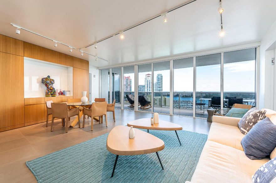 Prime location in Miami Beach, south of Fifth! This luxury waterfront condo, designed by renowned Venezuelan architect and interior designer Alejandro Barrios-Carrero (famous for his work at ''Juvia''), offers a stunning 2-bedroom, 2.5-bathroom modern residence in the sky. Located in SoFi, the home features a split-bedroom layout and breathtaking views of the Intracoastal, ocean, bay, and city. Fully remodeled, the bright interior boasts luxury designer finishes, spacious walk-in closets, an open floor plan, and a semi-private elevator entrance. All designer furniture is negotiable. The Murano Grande is a prestigious full-service building, with the Miami Beach marina just steps away for docking or chartering a boat, walk to top shops, restaurants, bars, fitness classes, and the beach!