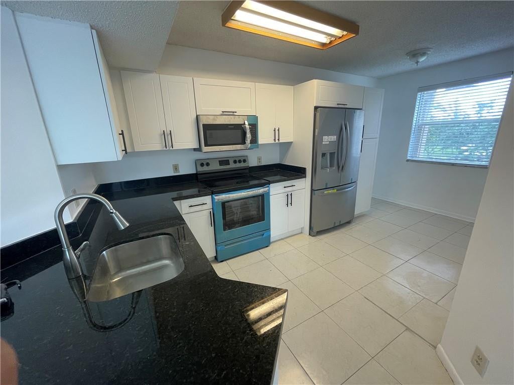 Photo of 9033 WILES Road #302, Coral Springs, FL 33067 (MLS # B26078948)