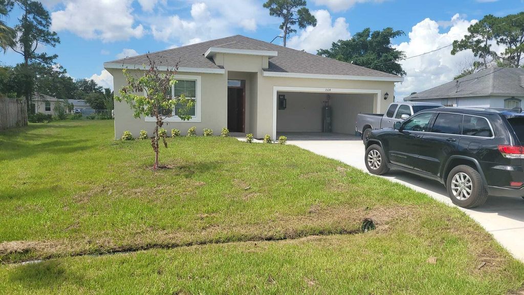 Photo of 1524 SW Bermel Avenue, Port Saint Lucie, FL 34953 (MLS # R10813508)