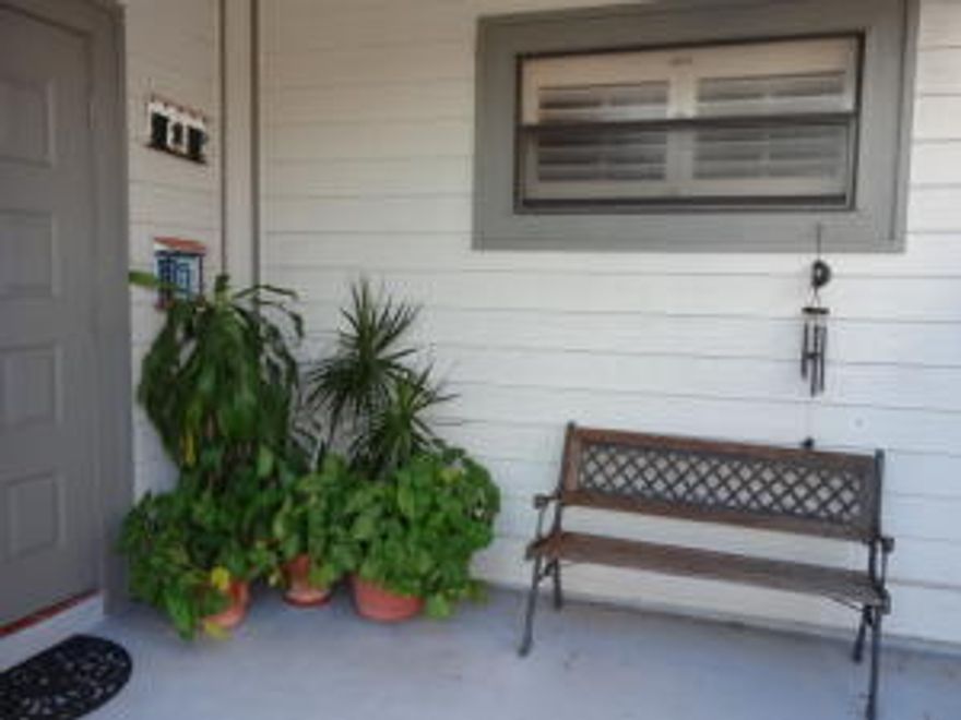 This charming 2 bedroom 2 bath home in the heart of Wellington close to WEF and Global has been updated with French doors, whitewash wood flooring in the main living space and  granite countertops with stainless steel appliances in the kitchen.