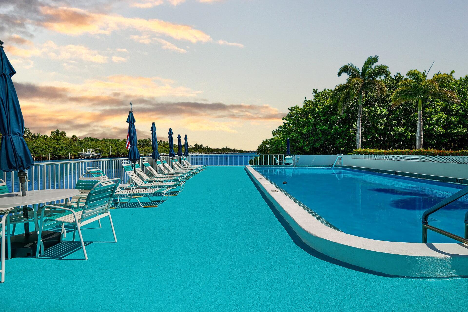 Waterfront 55+ Living Between the Ocean & Intracoastal Waterway! Wake up to sea breezes at Tropicana in this charming 1BR/1BA co-op/condo, ideally located in South Palm Beach. Enjoy coffee on your covered porch, then stroll or bike the scenic S. Ocean Blvd trail to the public beach, Dune Deck, Eau Palm Beach Resort & Spa (featuring Nobu), Publix, Ice Cream Club, Art Basil, Thaikyo, John G's, Lantana Nature Preserve, & more. The swimming pool overlooks the Intracoastal Waterway—perfect for a sunset swim. Additional features include assigned parking, storage, & on-site laundry facilities. Minutes to Old Key Lime House, Lake Worth Beach, public golf courses, & more. A rare chance for affordable coastal living close to everything you love. Cash only. No rentals or pets.