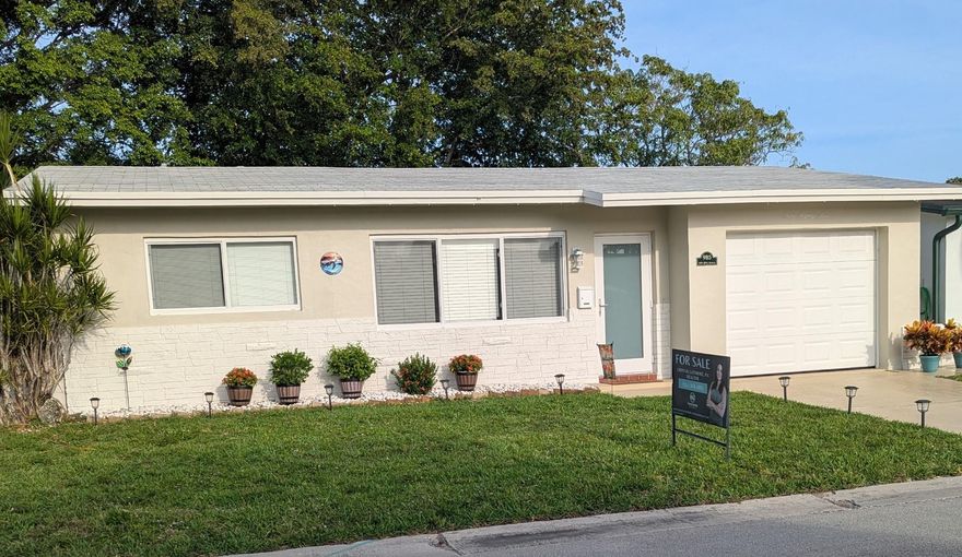 Charming & updated 2/1 single-family home in a desirable 55+ community with serene canal views. Roof replaced in 2021, full Impact Windows, front & garage doors, plus water heater 2015, handler 2016, and A/C 2019 for peace of mind. Inside features tile floors throughout and an updated bathroom with modern finishes, while the freshly painted exterior adds great curb appeal. Enjoy low HOA fees and wonderful amenities including a clubhouse and sparkling pool. With its prime location near shopping, dining, and entertainment, this canal-front gem offers the perfect South Florida lifestyle. Schedule your showing today!